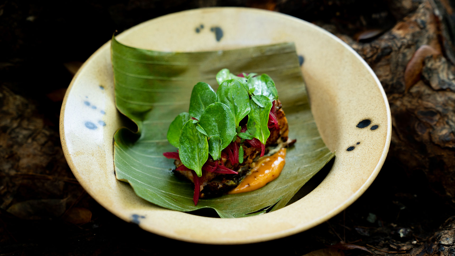 Banana-leaf fish on handmade ceramic