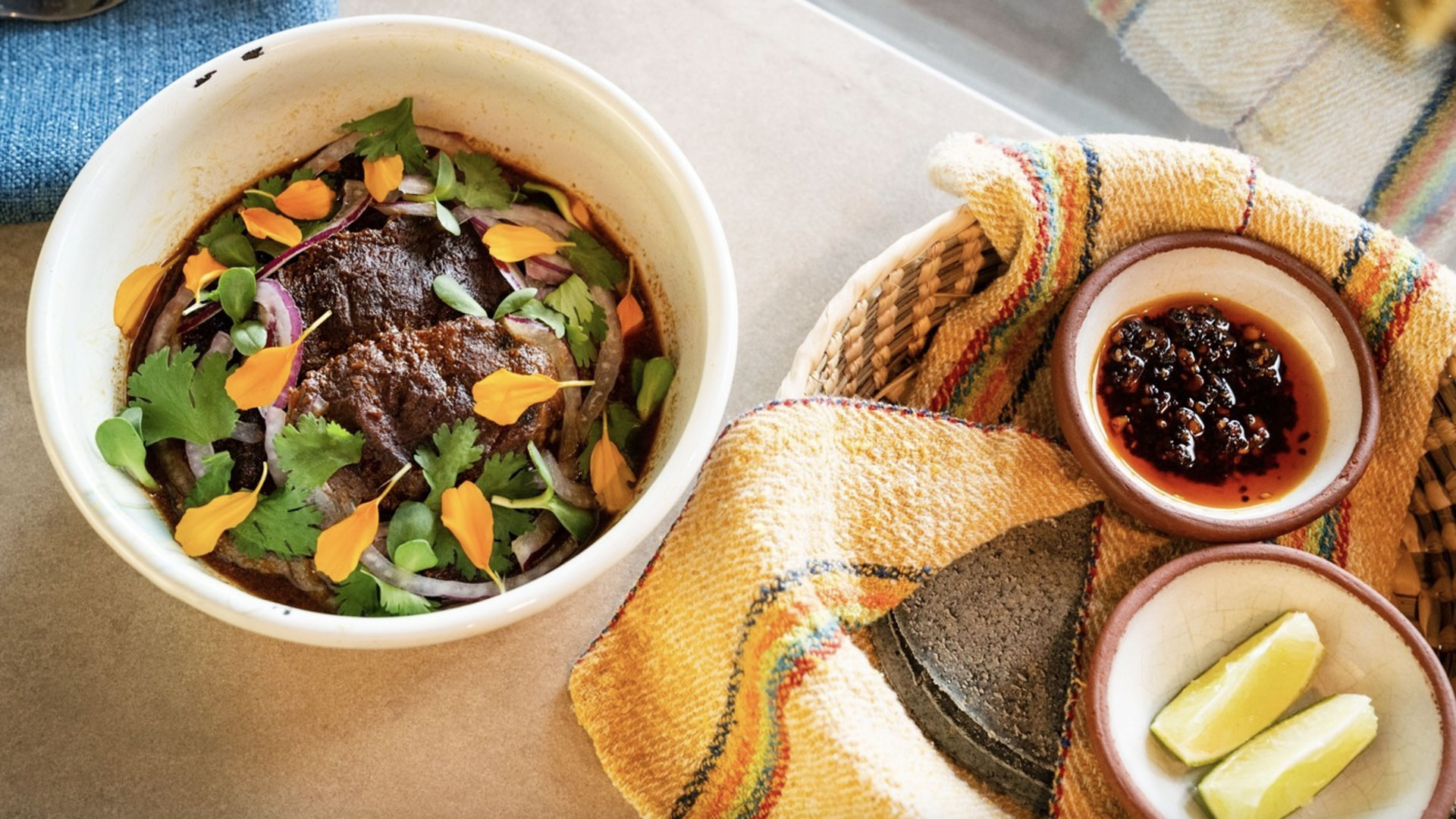 Birria with blue-corn tortillas and salsas